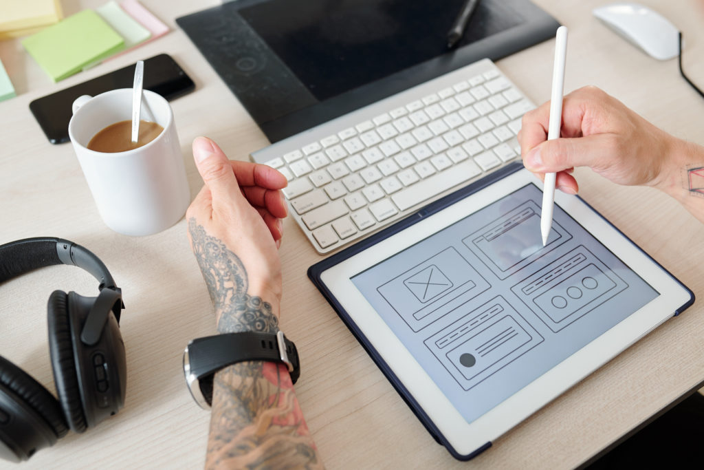 Should I Build or Buy My Website? 4 ui designer working on website interface 2021 09 01 07 48 01 utc